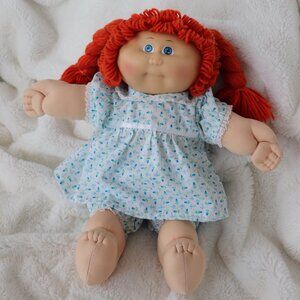 Vintage Cabbage Patch Kid girl with red hair and blue eyes